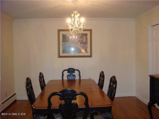 16 MacKenzie Glen Greenwich, CT 06830 - Photo 12 of 26 a dining room with furniture and chandelier