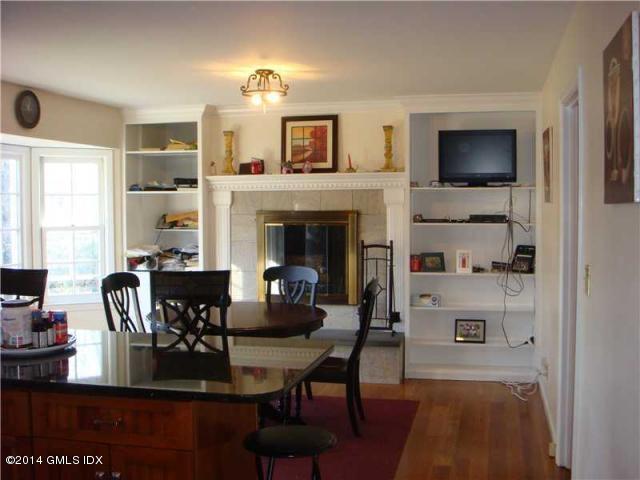 16 MacKenzie Glen Greenwich, CT 06830 - Photo 13 of 26 a view of a dining room with furniture window and wooden floor