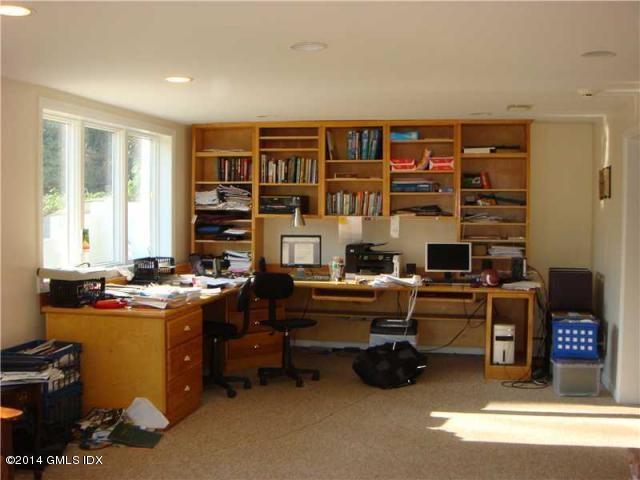 16 MacKenzie Glen Greenwich, CT 06830 - Photo 20 of 26 a work room with furniture and a book shelf