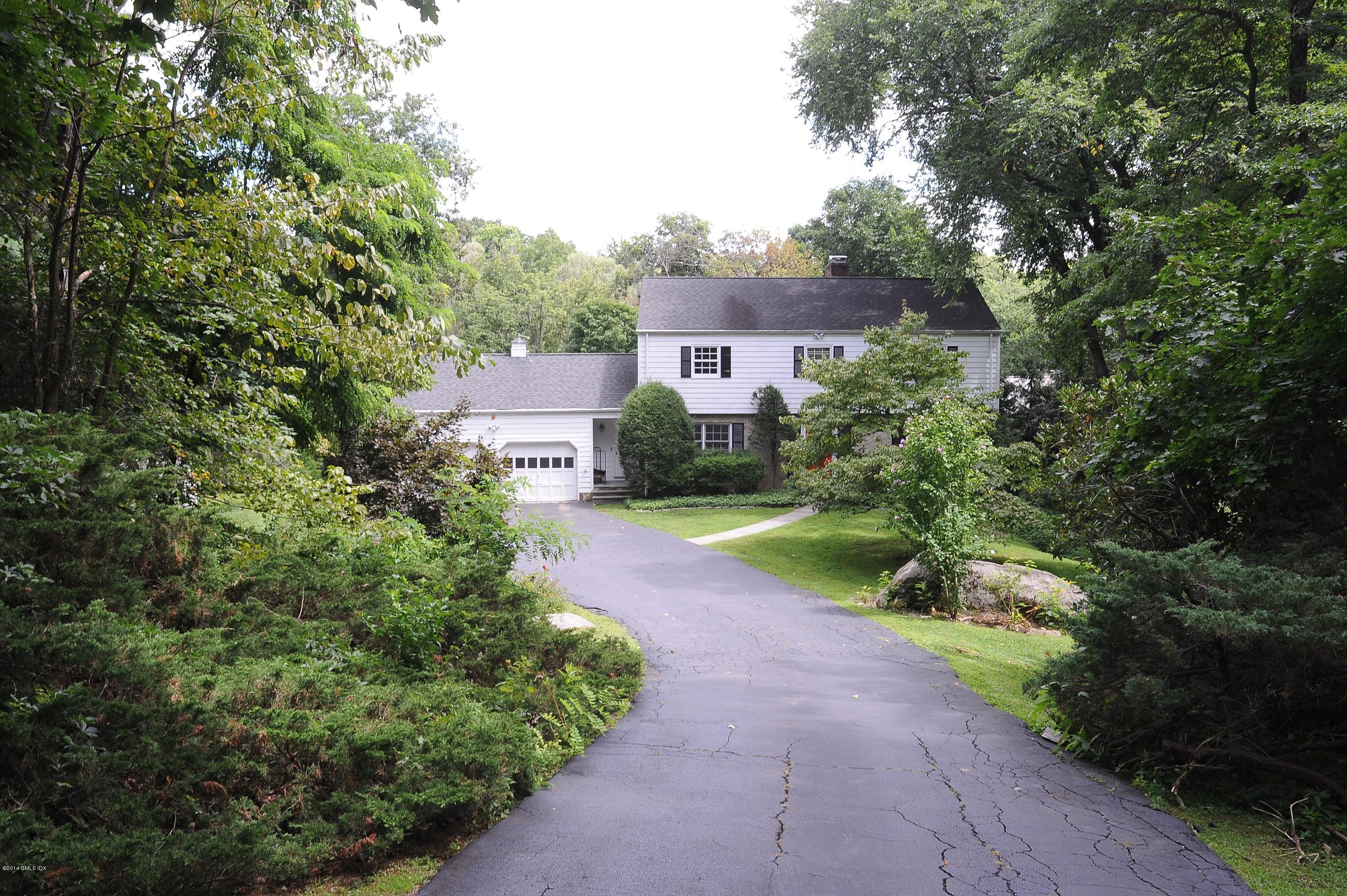 16 MacKenzie Glen Greenwich, CT 06830 - Photo 2 of 26 a view of a house with a yard