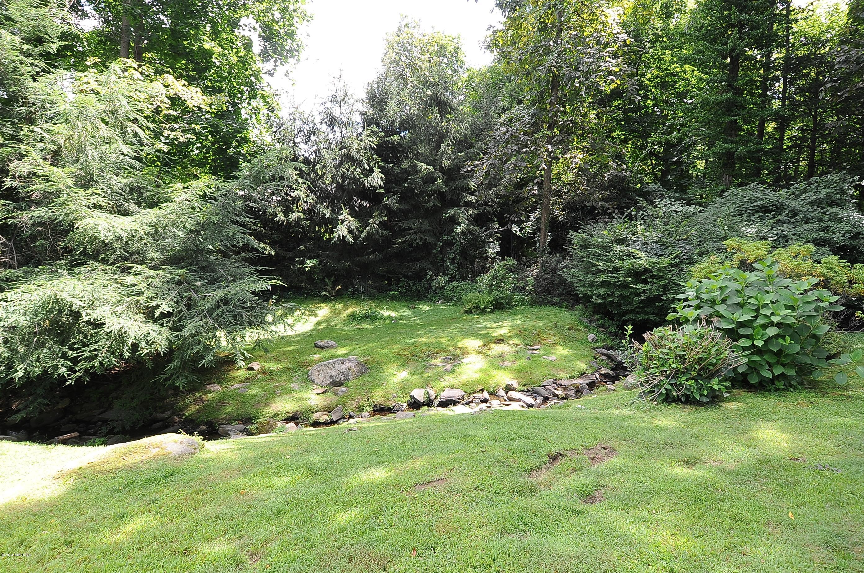16 MacKenzie Glen Greenwich, CT 06830 - Photo 25 of 26 a view of yard with green space