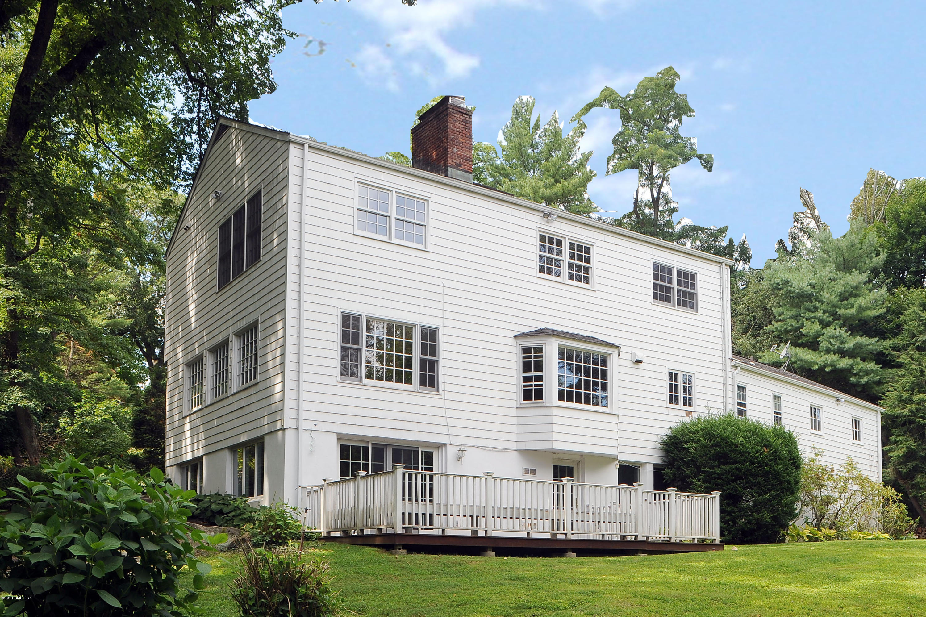 16 MacKenzie Glen Greenwich, CT 06830 - Photo 4 of 26 a view of a house with a yard