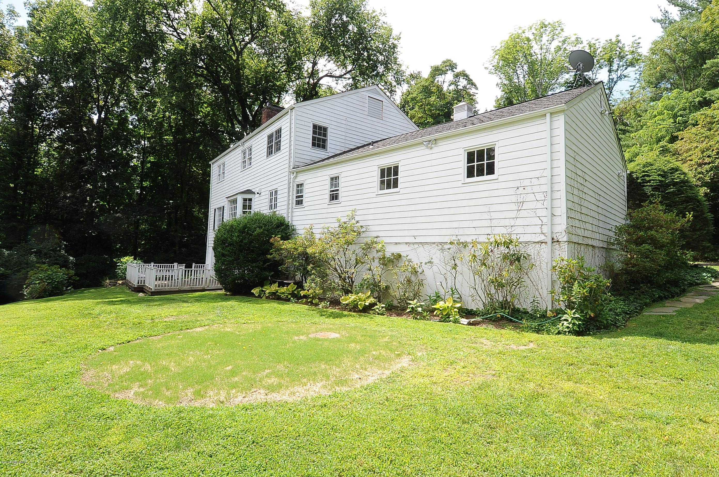 16 MacKenzie Glen Greenwich, CT 06830 - Photo 5 of 26 a view of a house with a yard