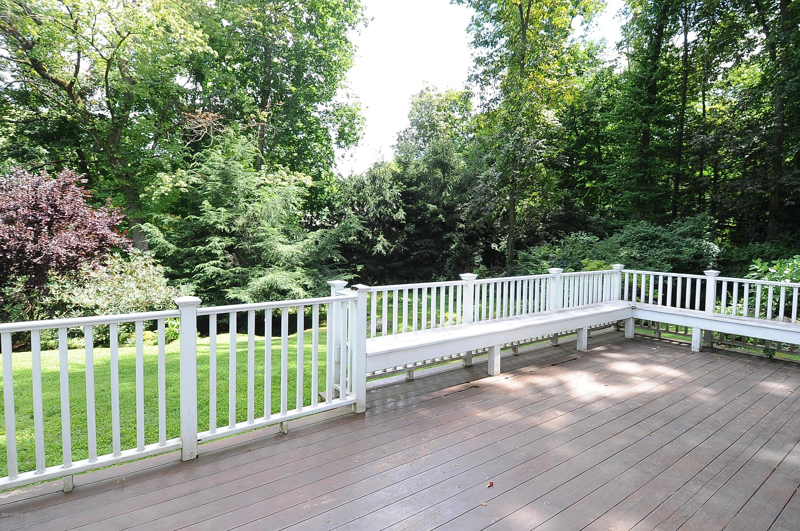 16 MacKenzie Glen Greenwich, CT 06830 - Photo 8 of 26 a view of a deck with a fence