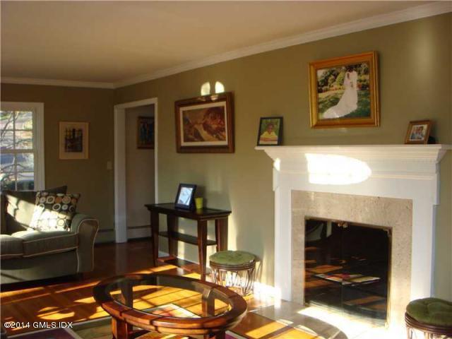 16 MacKenzie Glen Greenwich, CT 06830 - Photo 9 of 26 a living room with furniture and a fireplace