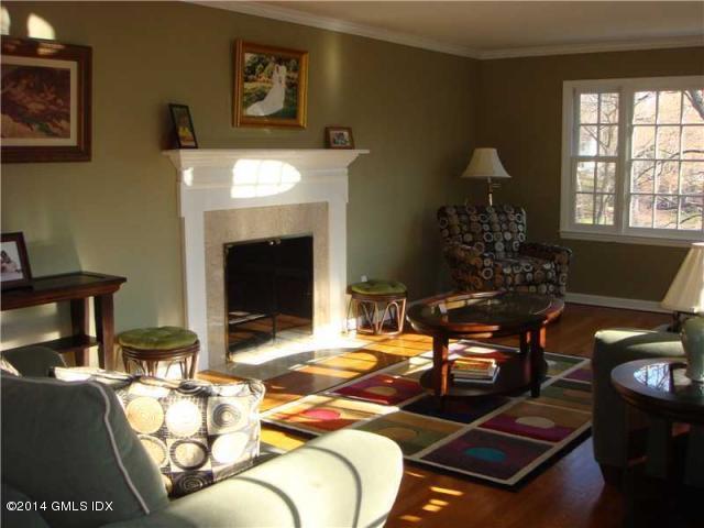 16 MacKenzie Glen Greenwich, CT 06830 - Photo 10 of 26 a living room with furniture and a fireplace