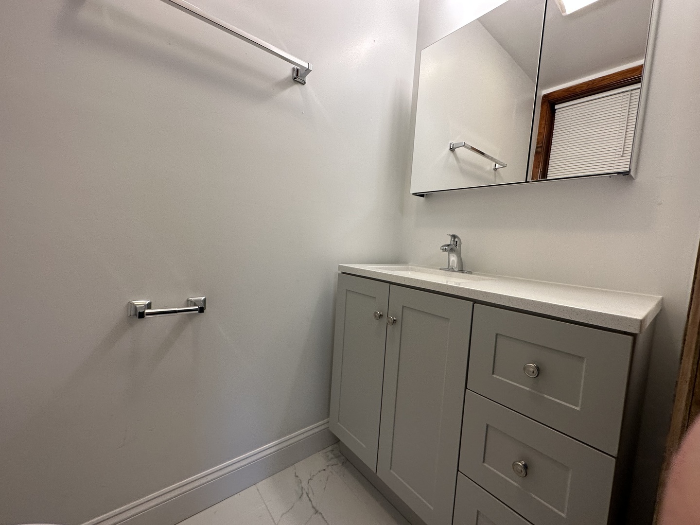 Undisclosed Address Chicago, IL 60618 - Photo 11 of 16 a bathroom with a sink and mirror