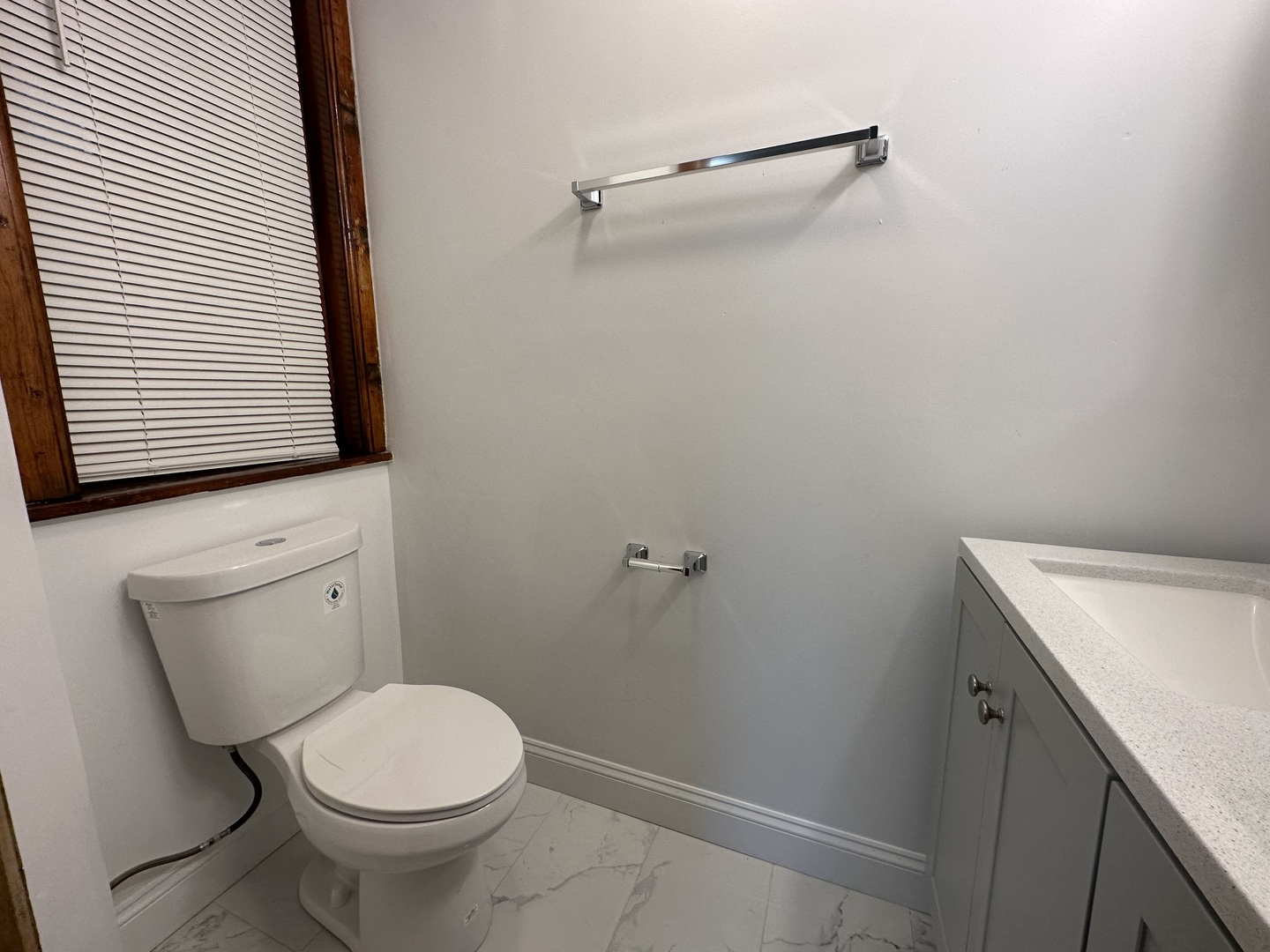 Undisclosed Address Chicago, IL 60618 - Photo 12 of 16 a bathroom with a toilet and a sink