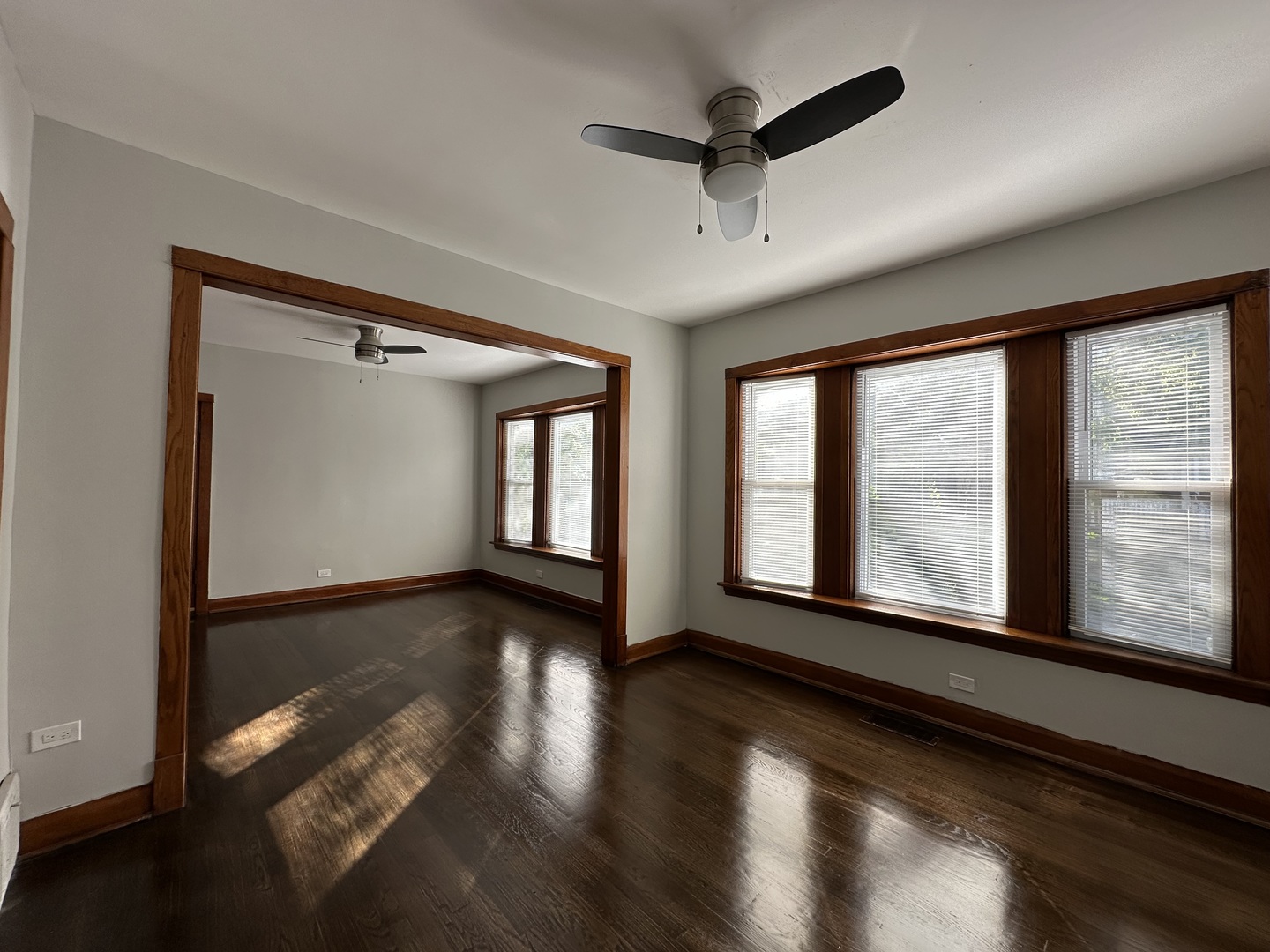 Undisclosed Address Chicago, IL 60618 - Photo 5 of 16 a view of an empty room with wooden floor and a window