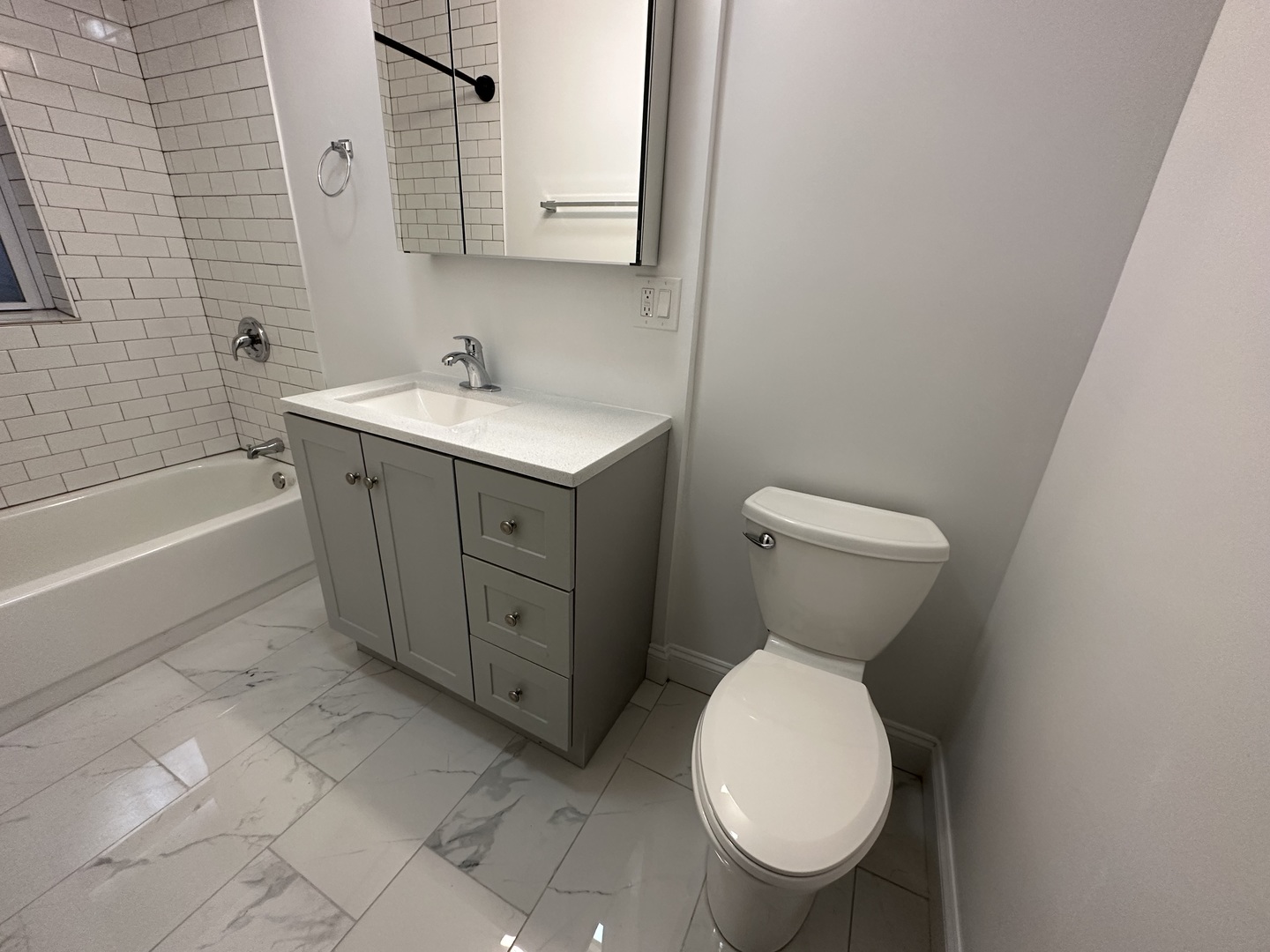 Undisclosed Address Chicago, IL 60618 - Photo 7 of 16 a bathroom with a toilet sink and mirror