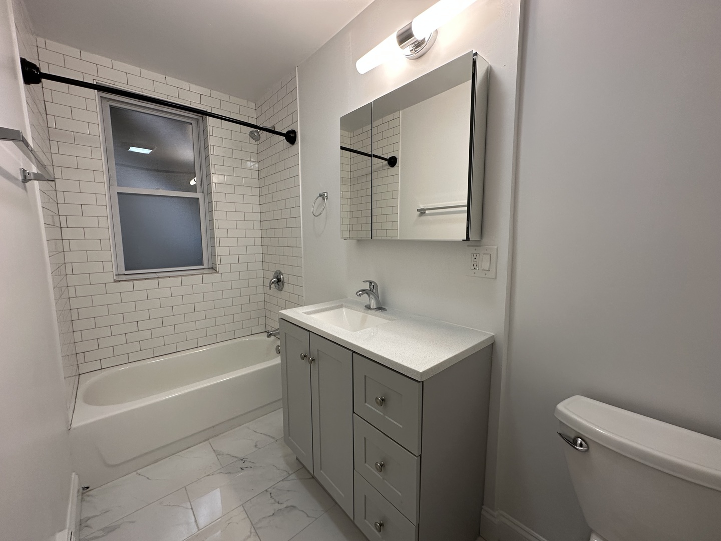 Undisclosed Address Chicago, IL 60618 - Photo 8 of 16 a bathroom with a sink a toilet and shower