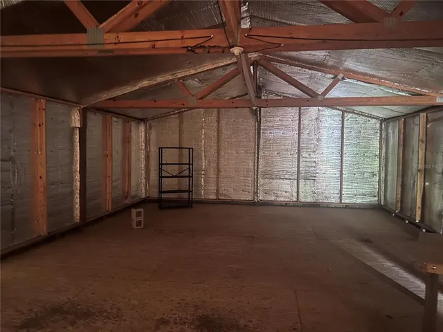 a view of empty room with windows
