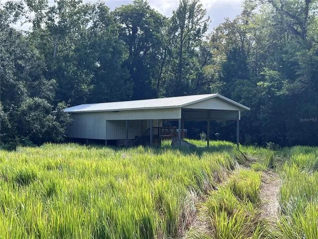 a view of a backyard of the house