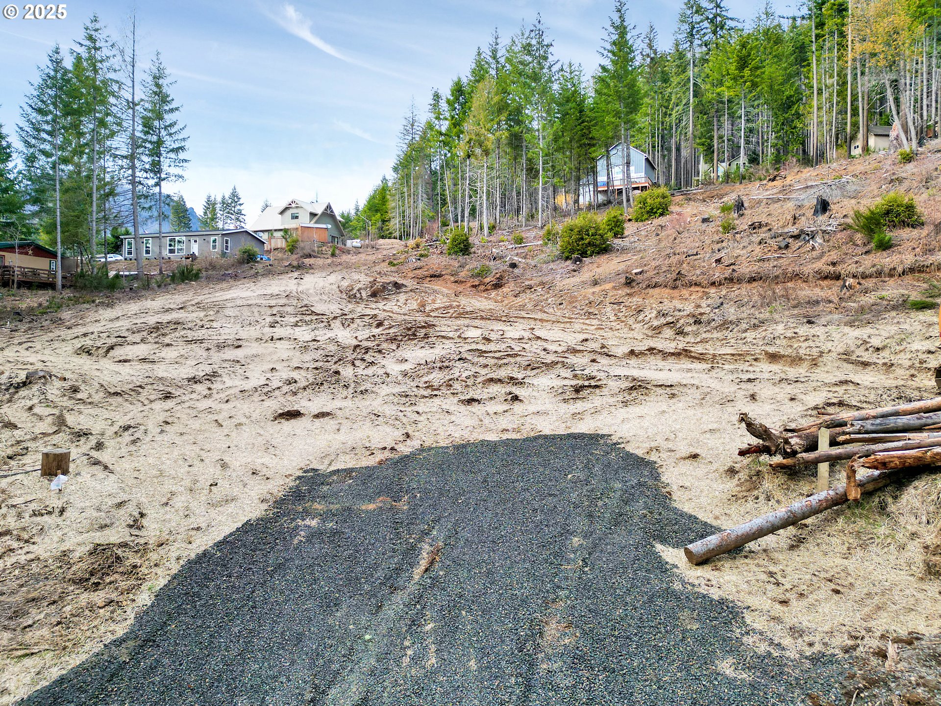 110 Guy Moore Road, Unit 1 Detroit, OR 97342 - Photo 3 of 11 a view of a dirt road with a building in the background
