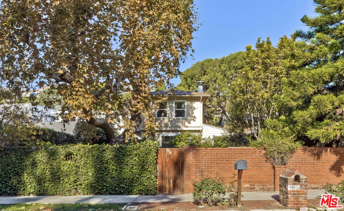 a view of a house with a tree