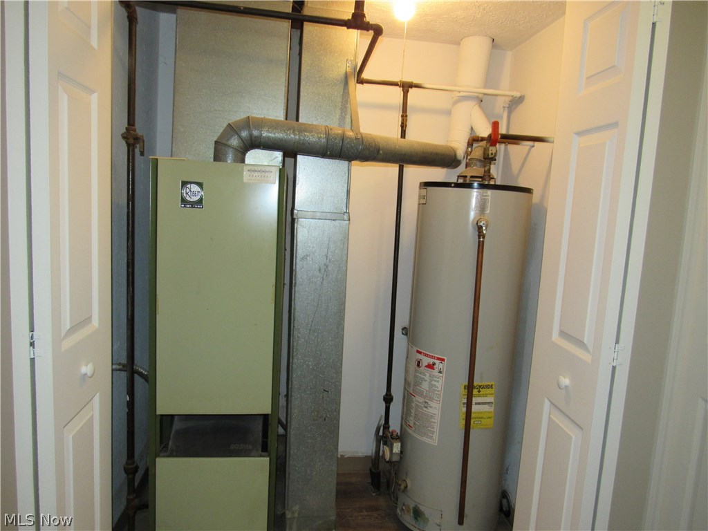 48-50 Hurst Road Painesville, OH 44077 - Photo 8 of 34 First closet holds the furnace & hot water tank!