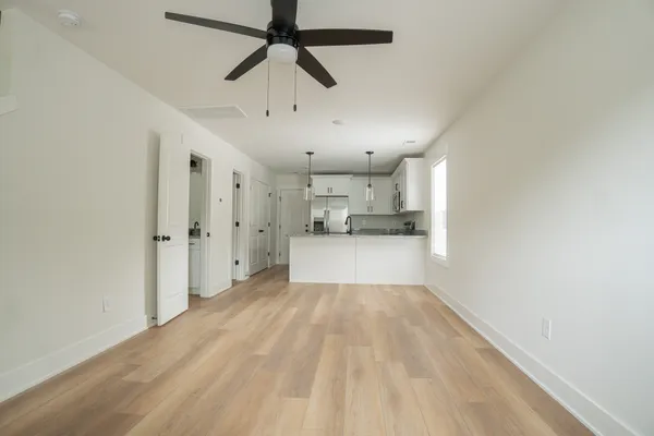 a view of a kitchen with a sink and a window