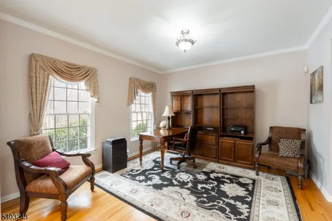 a living room with furniture rug and window