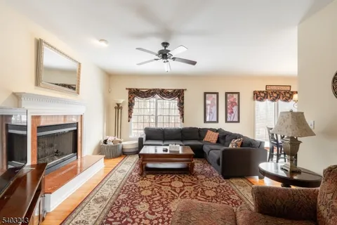 a living room with furniture fireplace and a flat screen tv