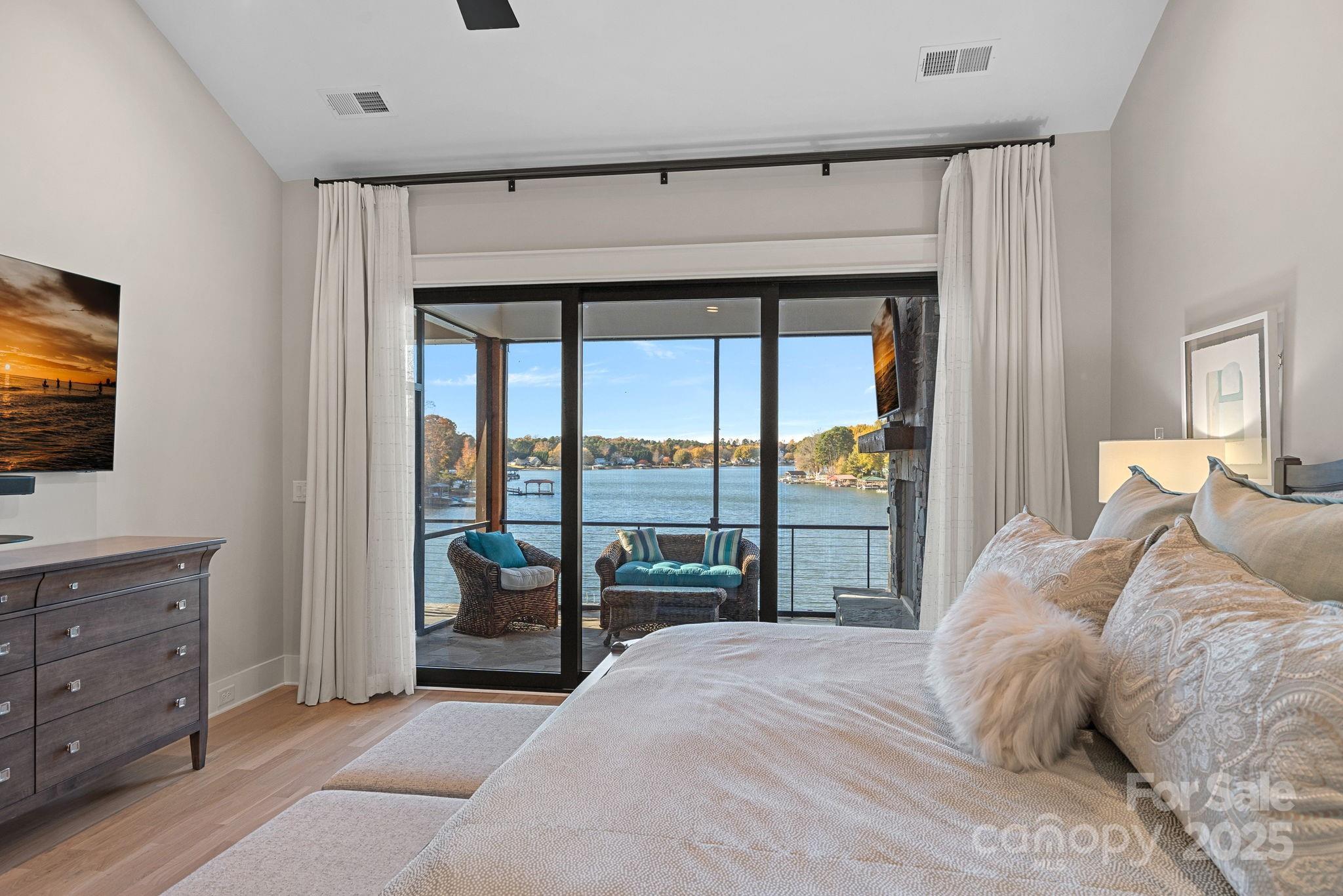162 West Maranta Road Mooresville, NC 28117 - Photo 16 of 46 a bedroom with a large bed and a flat tv screen on dresser