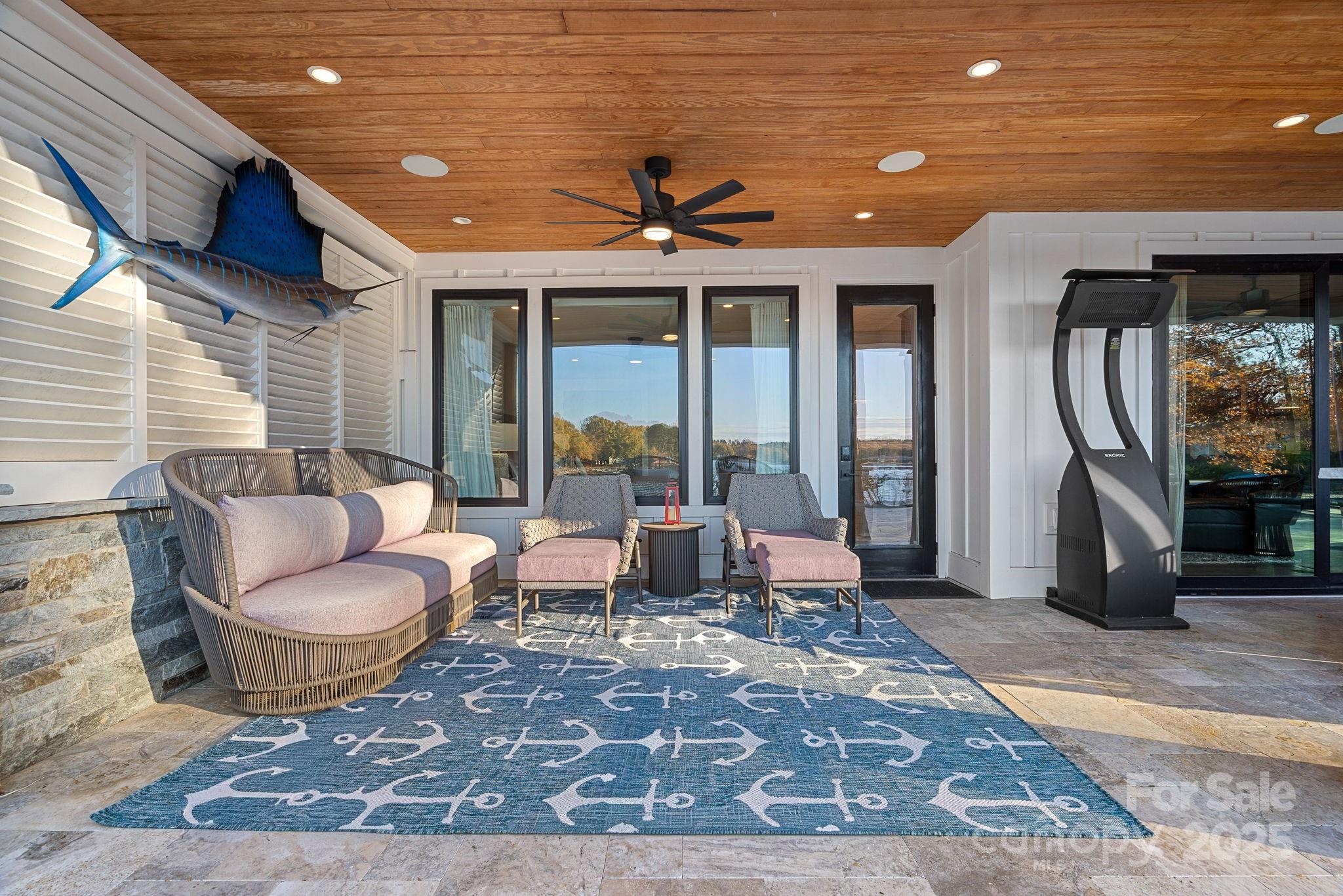 162 West Maranta Road Mooresville, NC 28117 - Photo 35 of 46 a living room with a rug floor to ceiling window and a rug