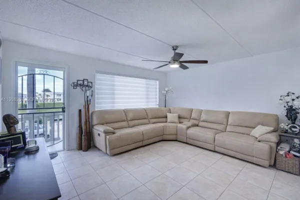 a living room with furniture and a window