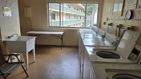 a kitchen with a sink cabinets and appliances