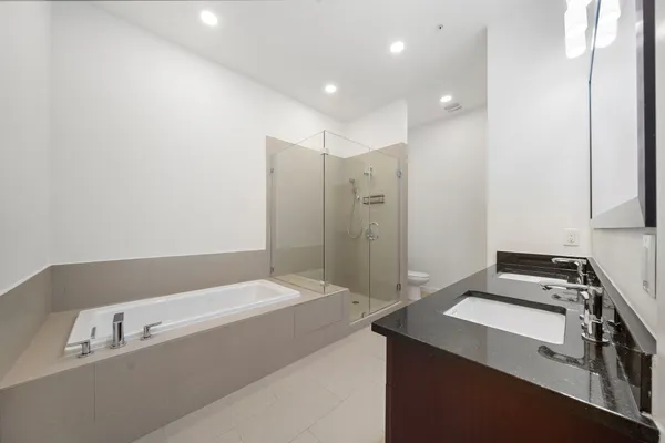 a bathroom with a bathtub and a sink