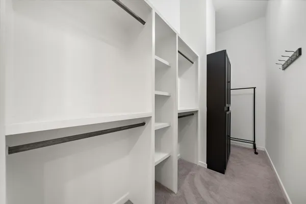 a view of a hallway with washer and dryer