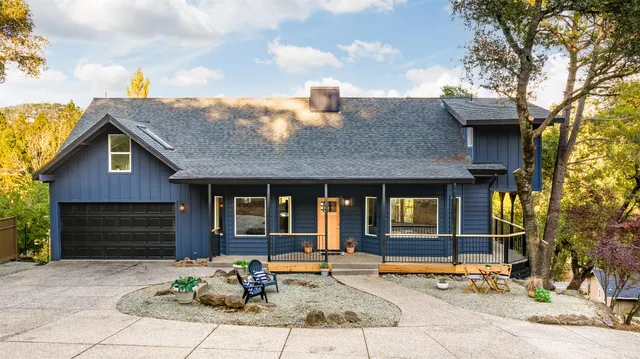 a backyard of a house with seating space