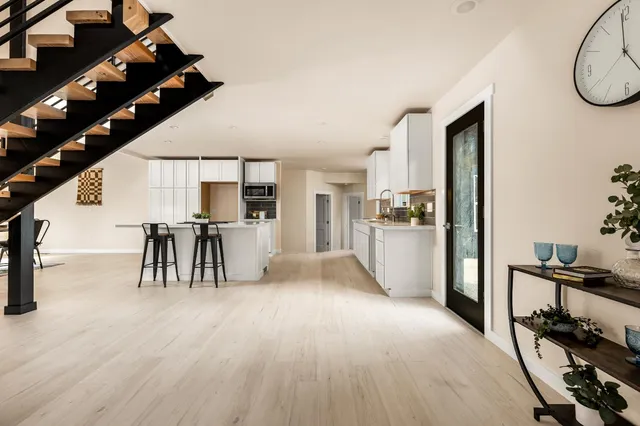 a view of a dining room with furniture and a window