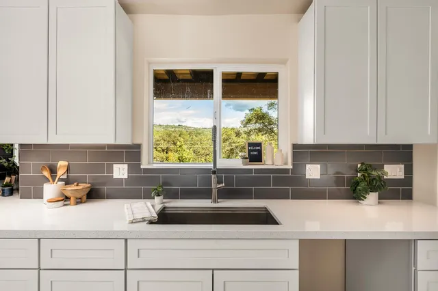 a view of kitchen with furniture and stove