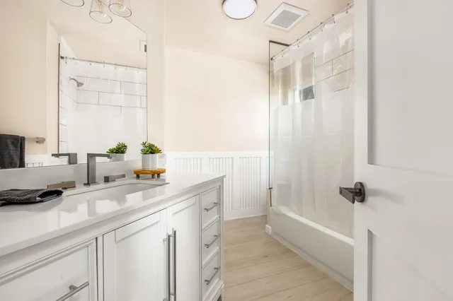 a view of an entryway with wooden floor