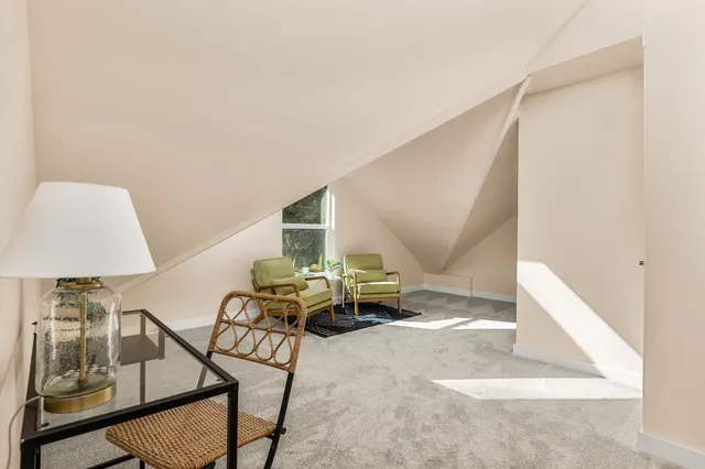 a view of swimming pool with outdoor seating and plants