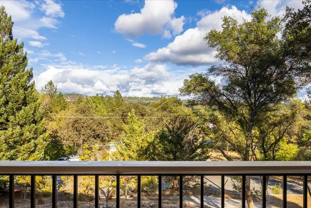 a view of a balcony with wooden floor