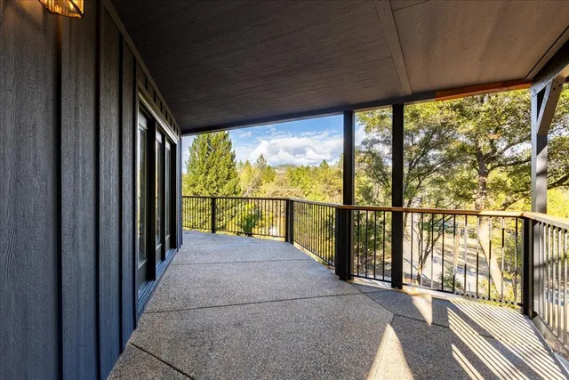 an aerial view of a house with a yard basket ball court and outdoor seating