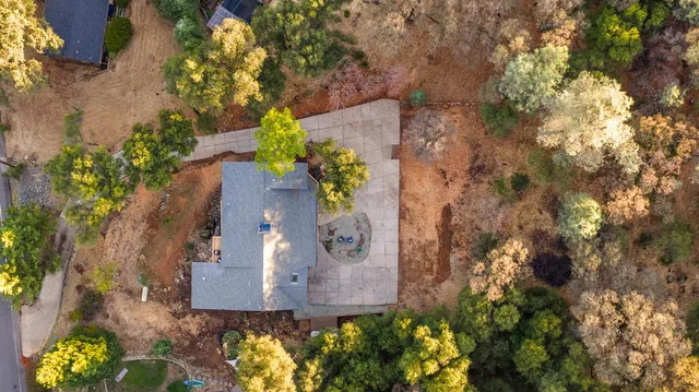 a view of a chairs and table in the patio