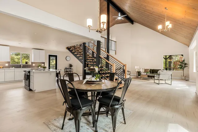 a dining room with furniture and entryway