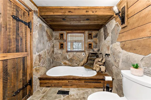 a bathroom with a toilet and a sink