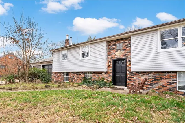 an aerial view of a house with lots of trees