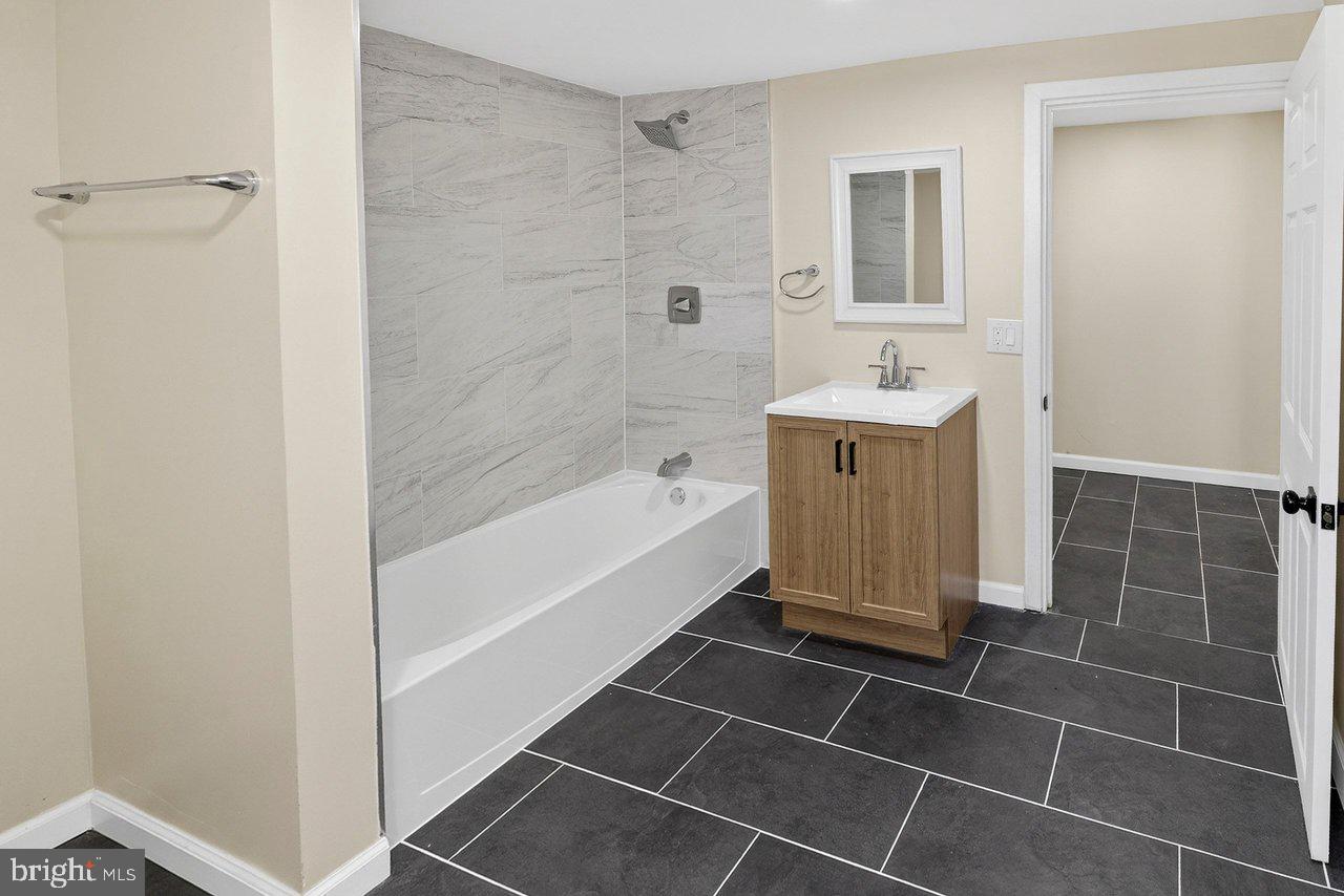 6 Olive Street Salem, NJ 08079 - Photo 12 of 15 a spacious bathroom with a bathtub and a shower