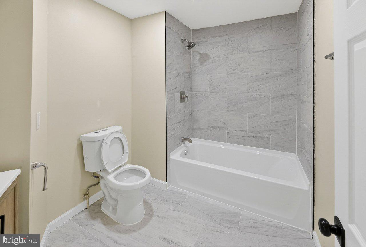 6 Olive Street Salem, NJ 08079 - Photo 15 of 15 a bathroom with a toilet and a bathtub