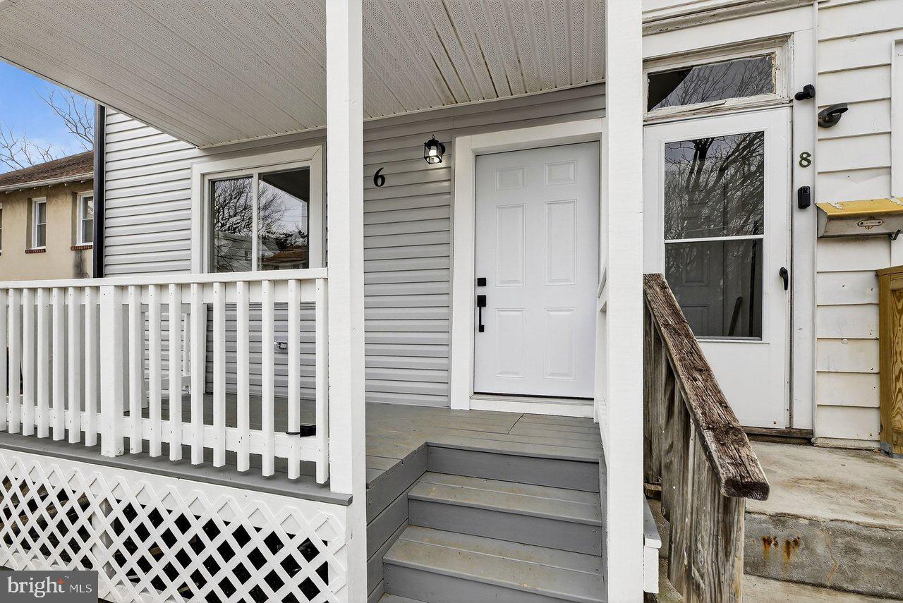 6 Olive Street Salem, NJ 08079 - Photo 2 of 15 a view of a house with wooden door and stairs