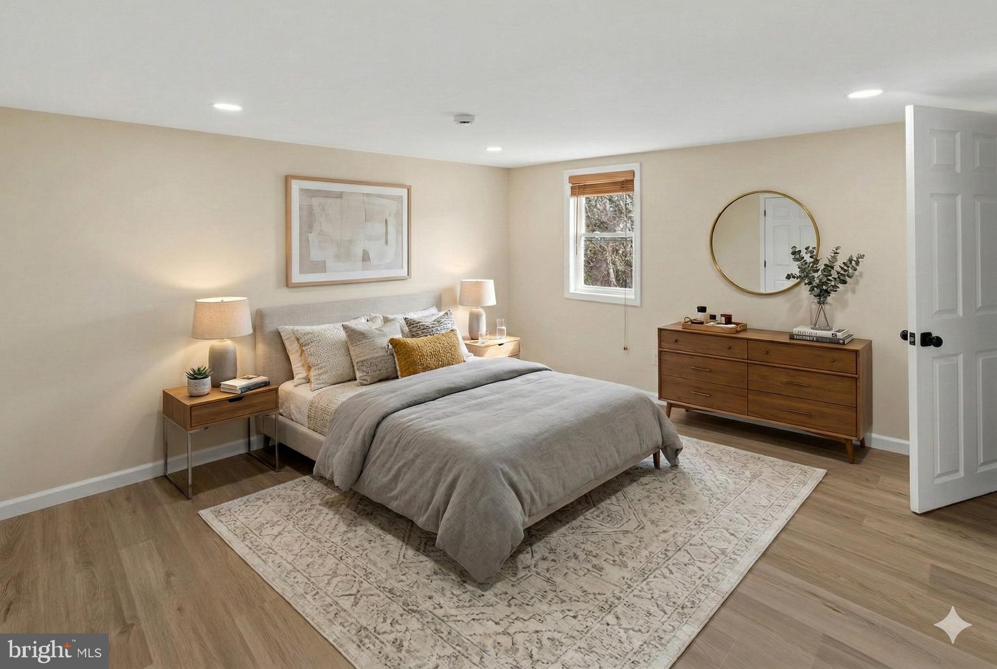 6 Olive Street Salem, NJ 08079 - Photo 8 of 15 a bedroom with a bed mirror and window