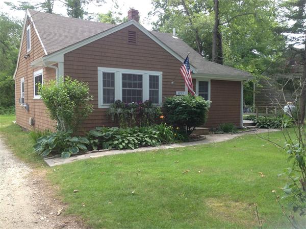 897 Point Road Marion, MA 02738 - Photo 2 of 8 a front view of house with yard and green space