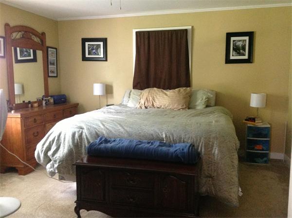 897 Point Road Marion, MA 02738 - Photo 7 of 8 a bedroom with a bed and a lamp