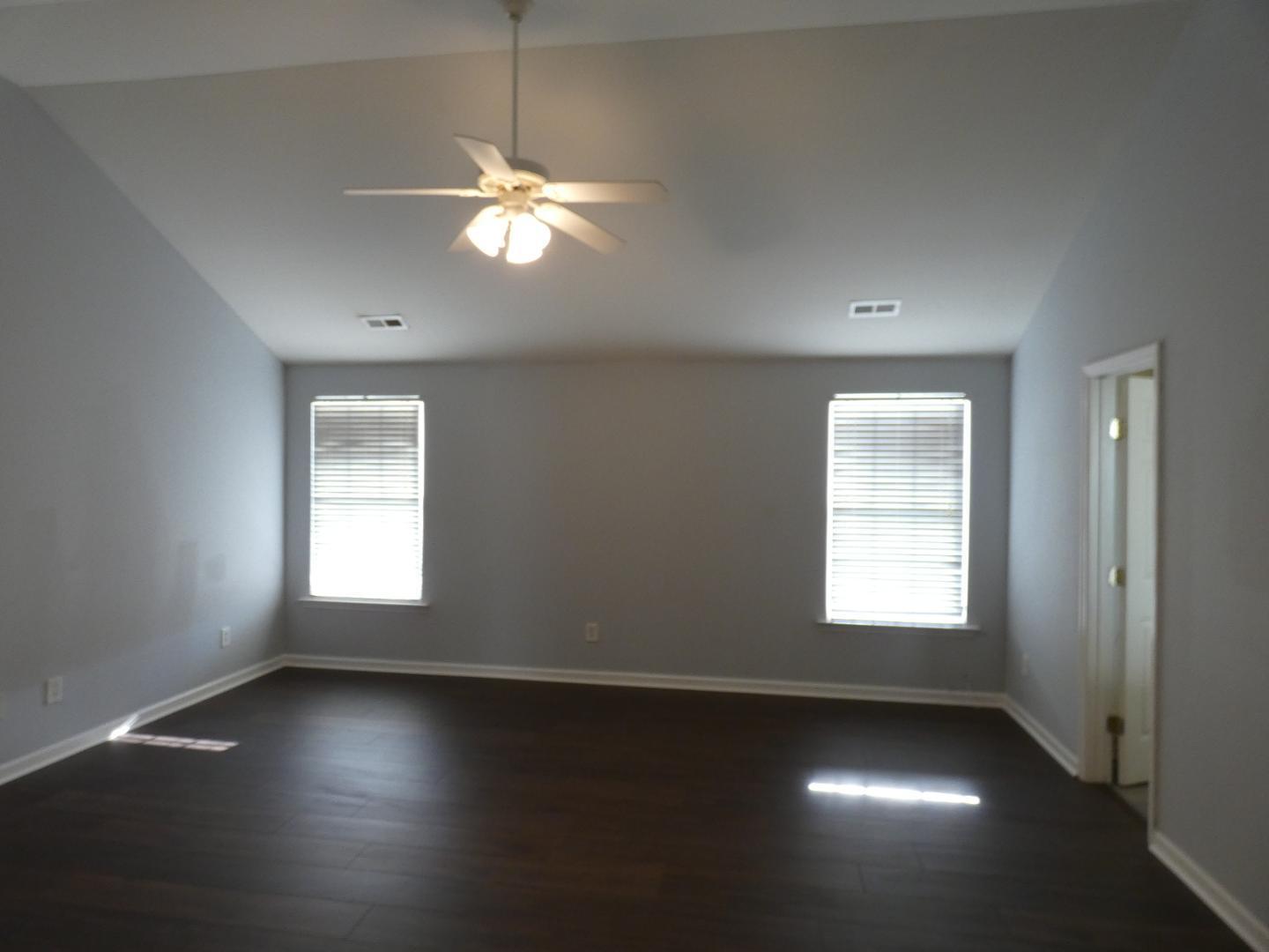 1624 Brown Owl Drive Raleigh, NC 27610 - Photo 12 of 22 a view of an empty room with wooden floor and a window