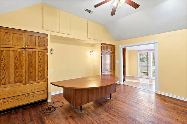 a bathroom with a toilet a sink and a window