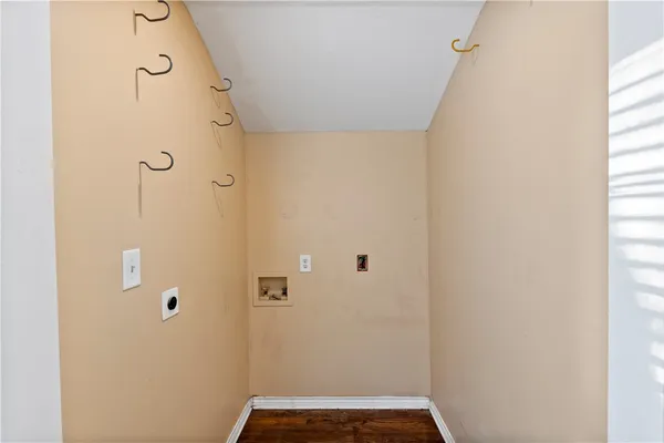 a room with white cabinets and white walls