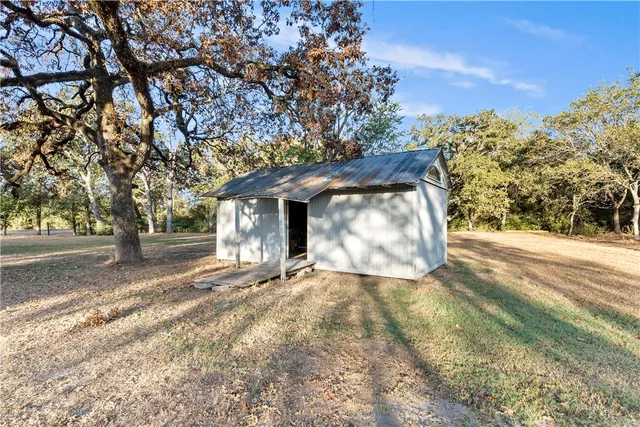 a house with trees in the background